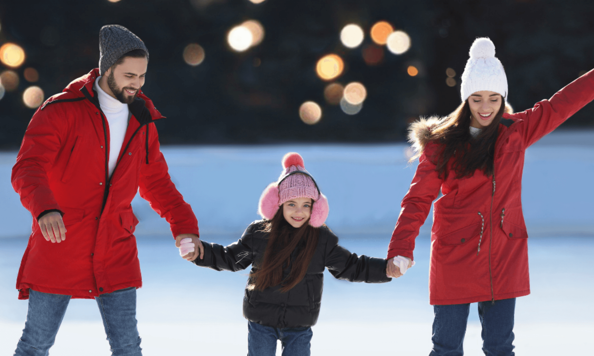 Family Holding Hands and Ice Skating