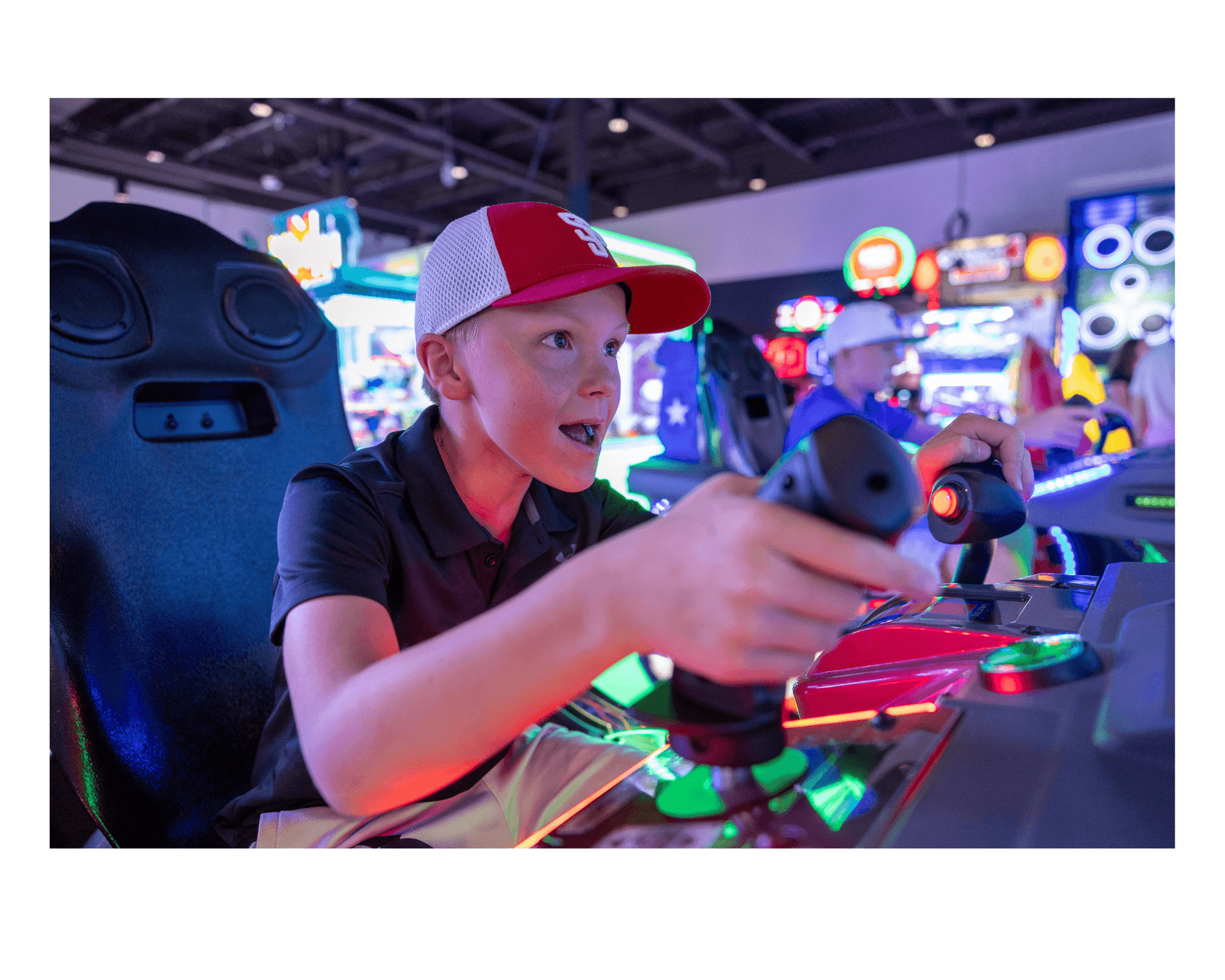 Megaplex cinema entertainment cente- kid playing a game