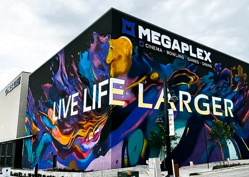 Megaplex cinema entertainment center life life larger building mural